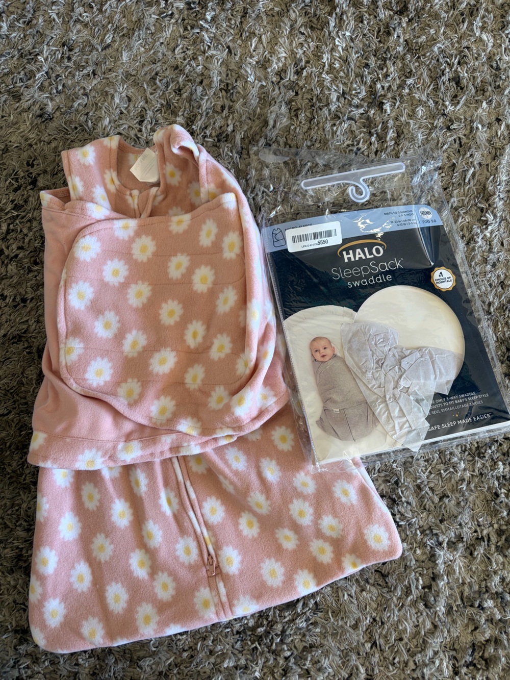 Halo SleepSack Swaddle in Black and Gold Logo Dasies